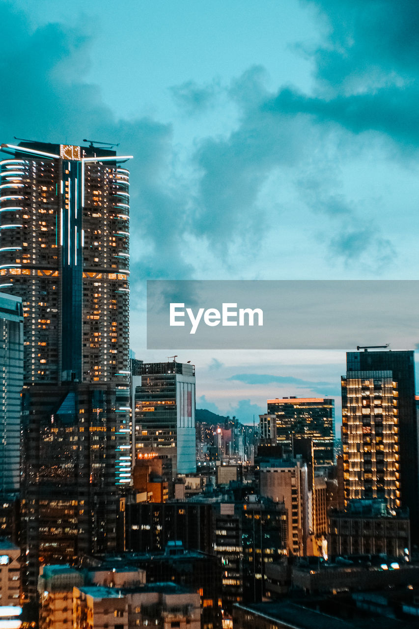 MODERN BUILDINGS IN CITY AGAINST SKY