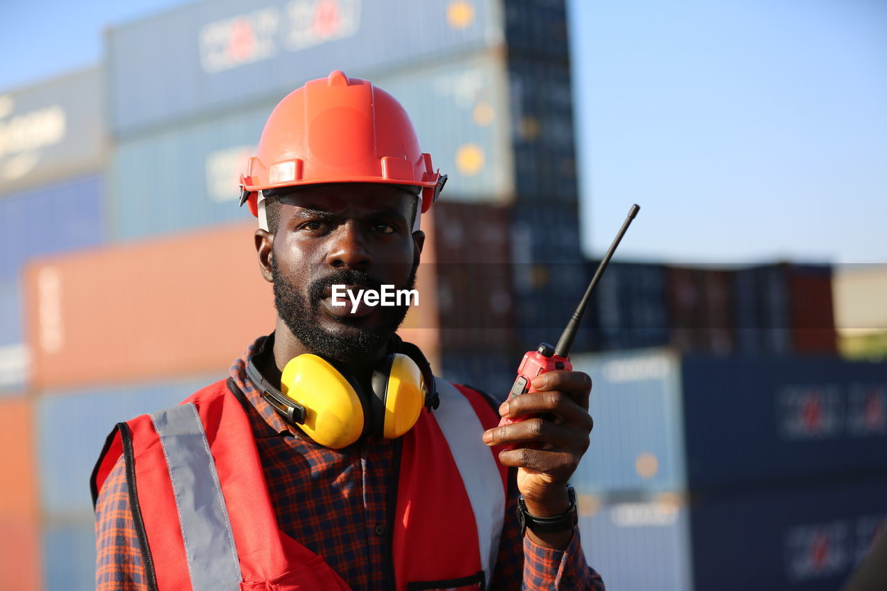 portrait of man holding hardhat