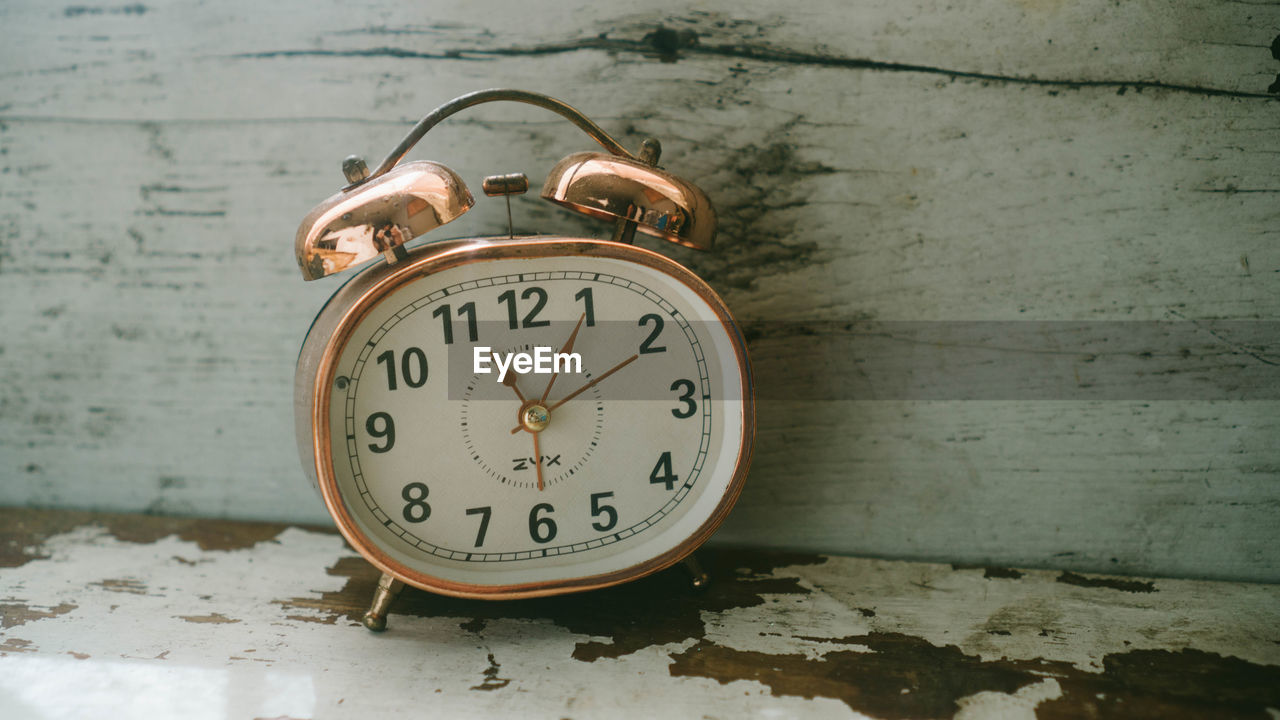 High angle view of alarm clock on table