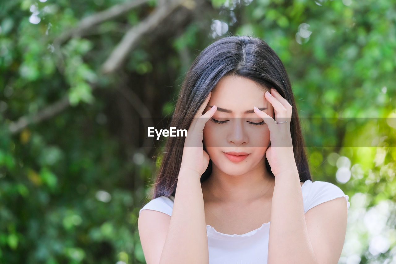 CLOSE-UP PORTRAIT OF A GIRL WITH EYES CLOSED