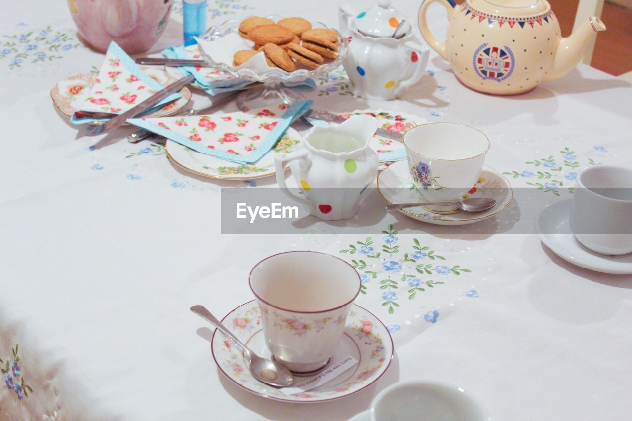 Midsection of coffee cup on table