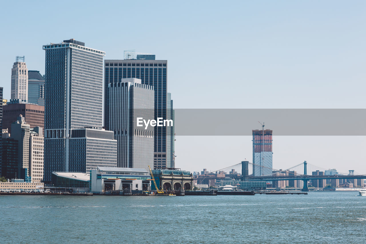 Skyscrapers in city against clear sky