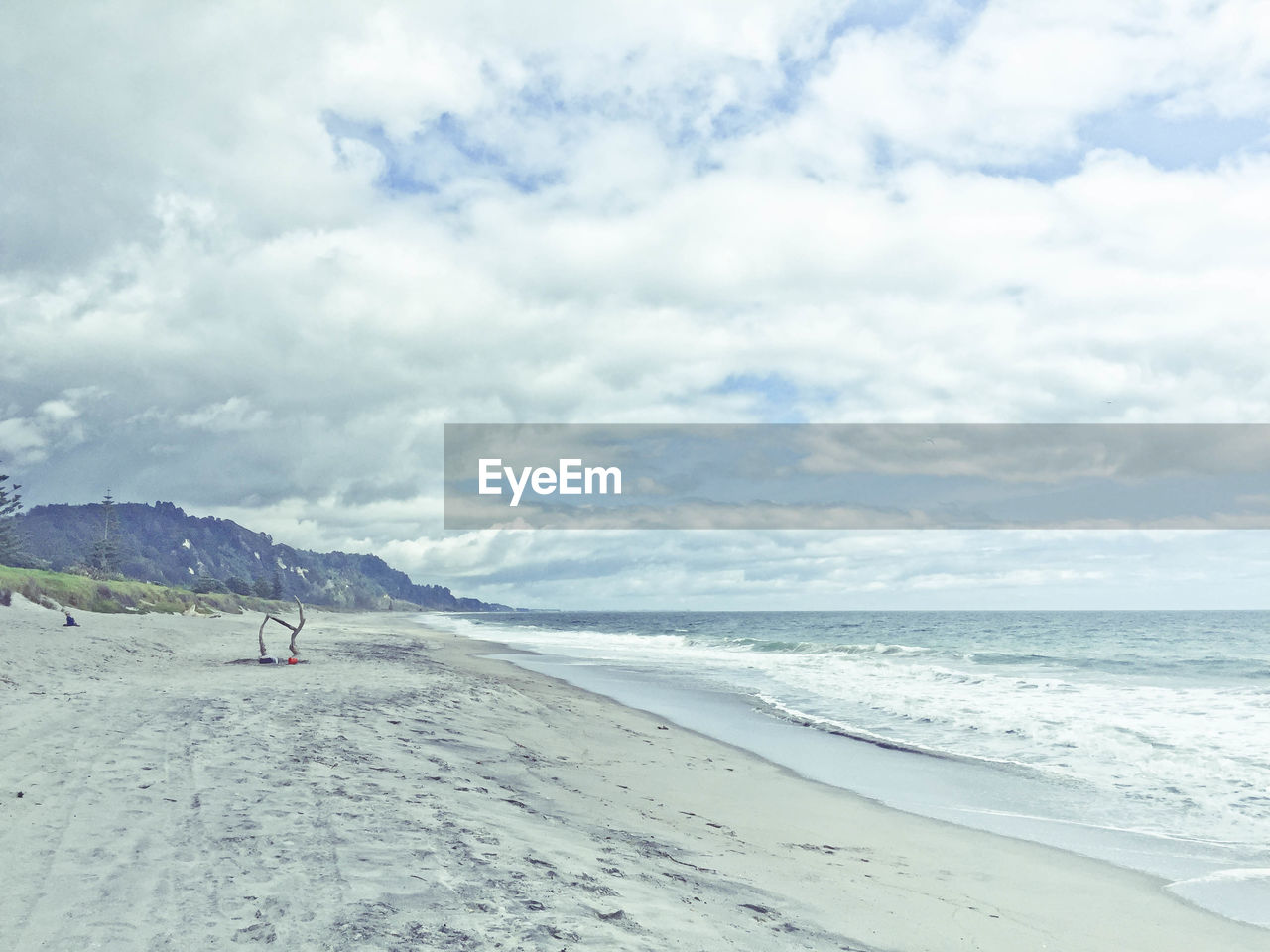 Scenic view of beach against sky