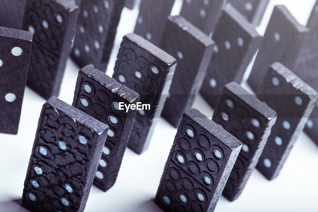 Close-up of dominoes over white background