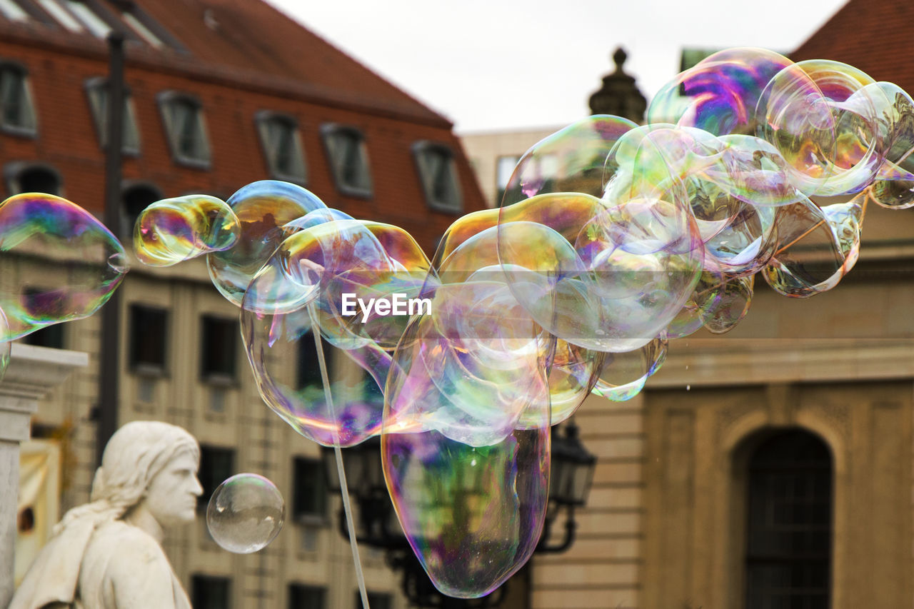 Soap bubbles and sculpture in center of berlin.