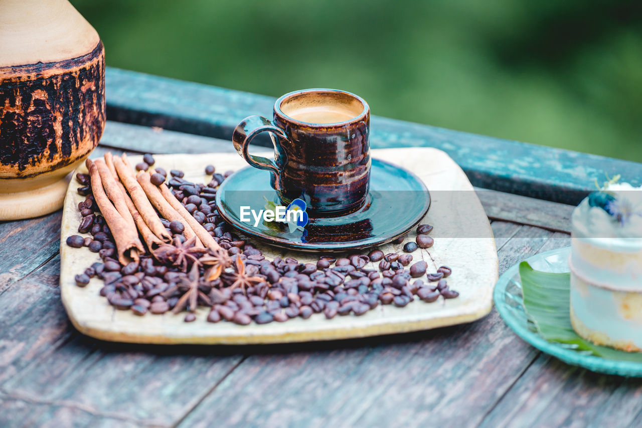 food and drink, drink, food, table, crockery, refreshment, coffee cup, saucer, cup, mug, wood, coffee, plate, hot drink, no people, freshness, tea, sweet food, nature, day, healthy eating, outdoors, selective focus, baked, sweet