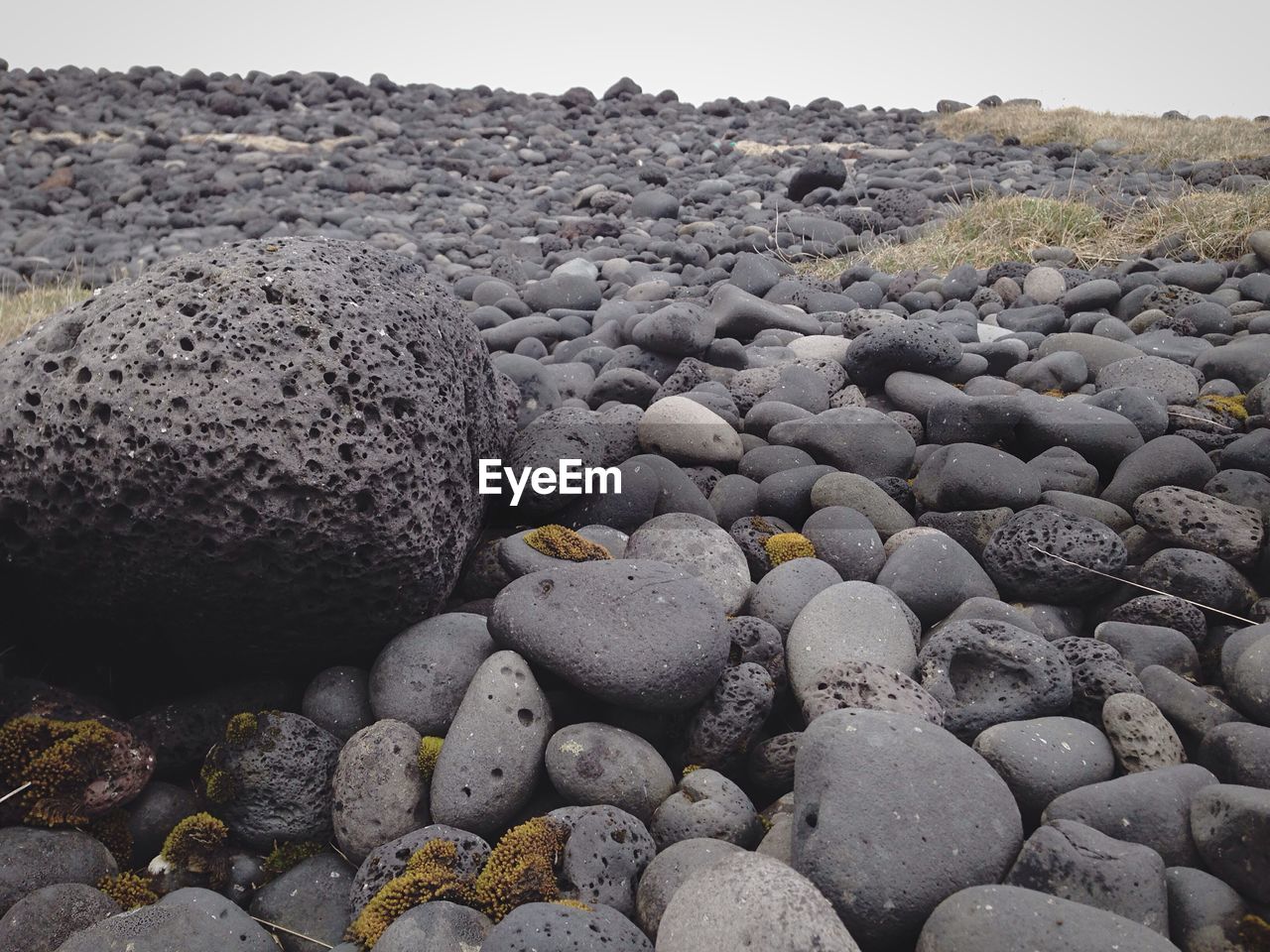 Rocky field against sky