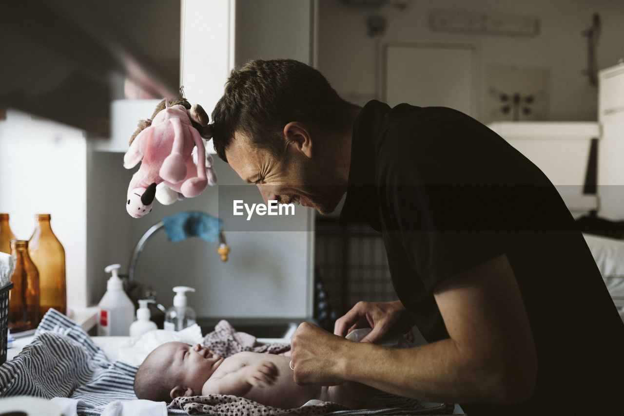 Father with baby at home