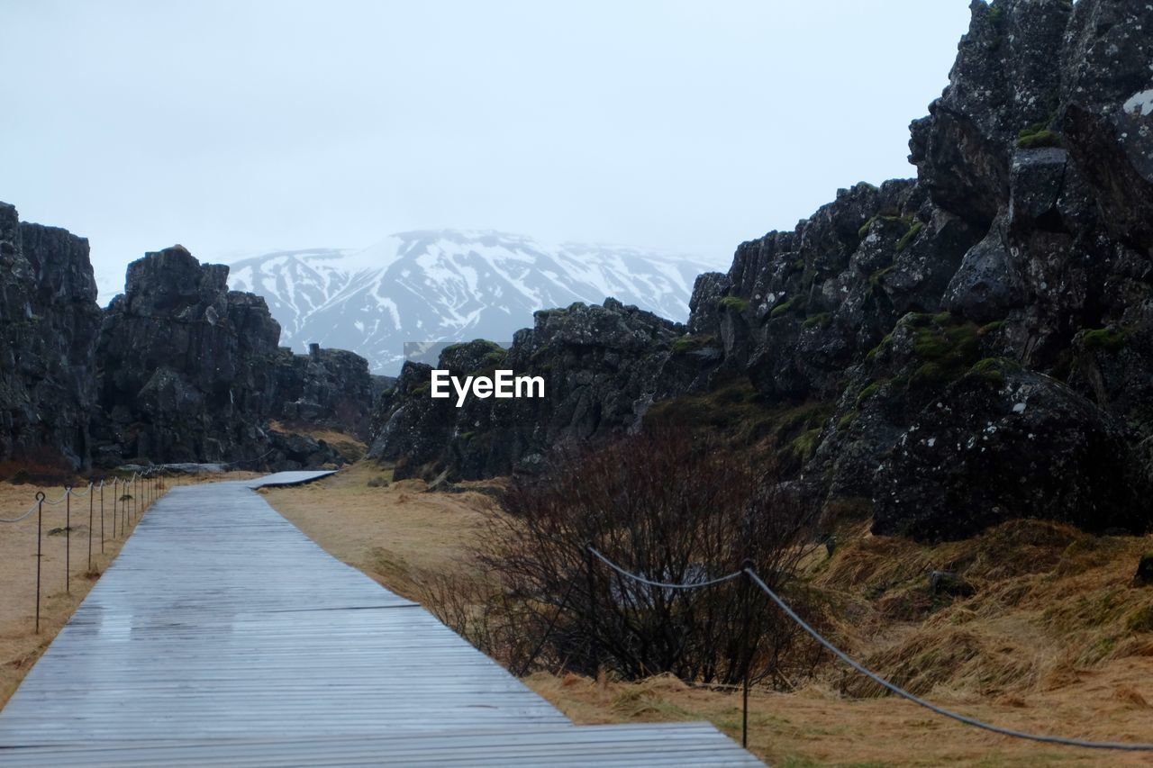 Scenic view of snowcapped mountains against sky