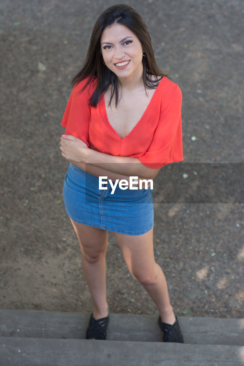 Model woman looking at camera during outdoors session