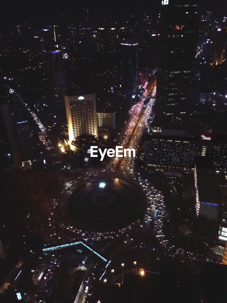 Aerial view of illuminated cityscape at night