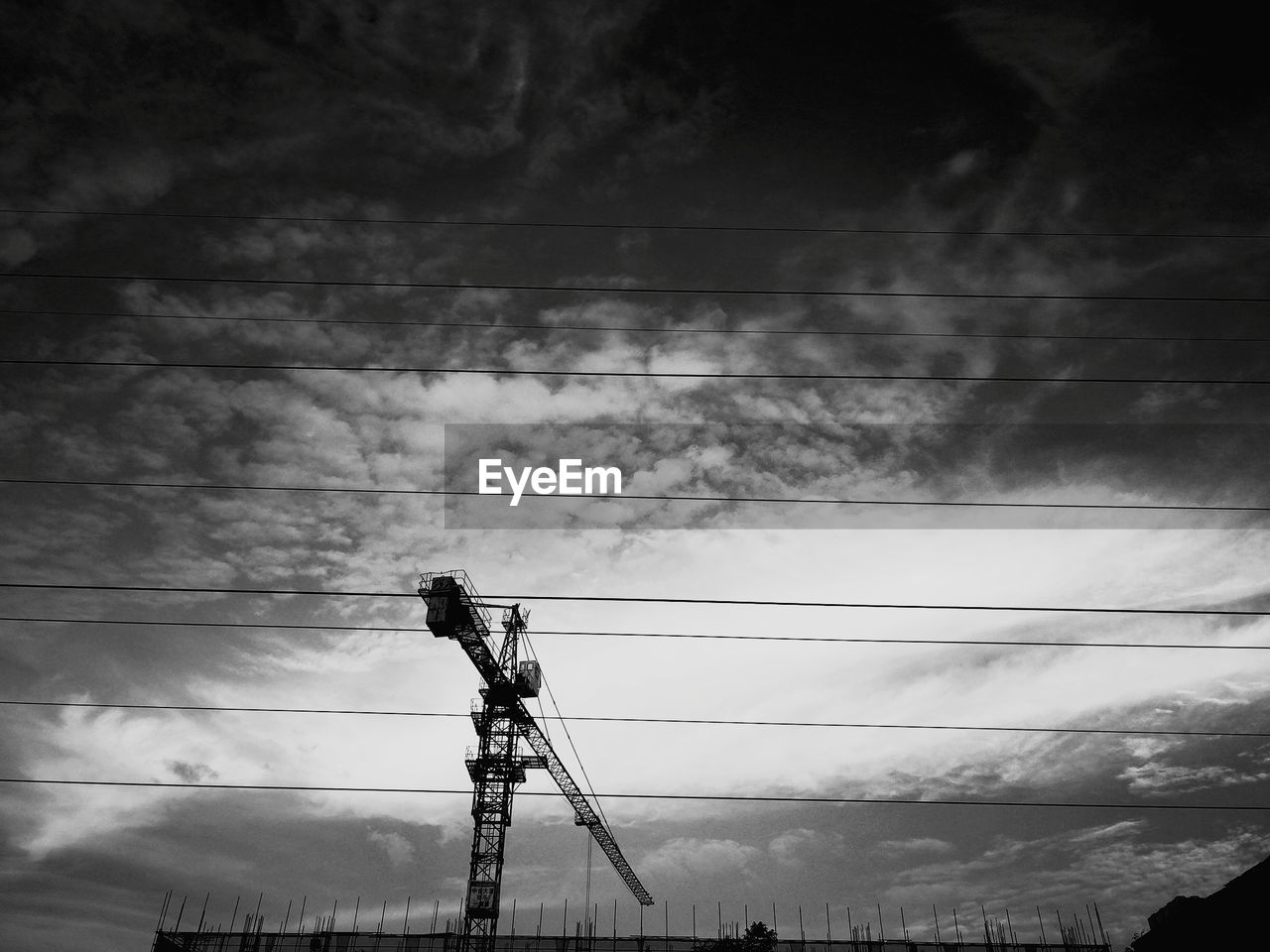 LOW ANGLE VIEW OF ELECTRICITY PYLONS AGAINST SKY