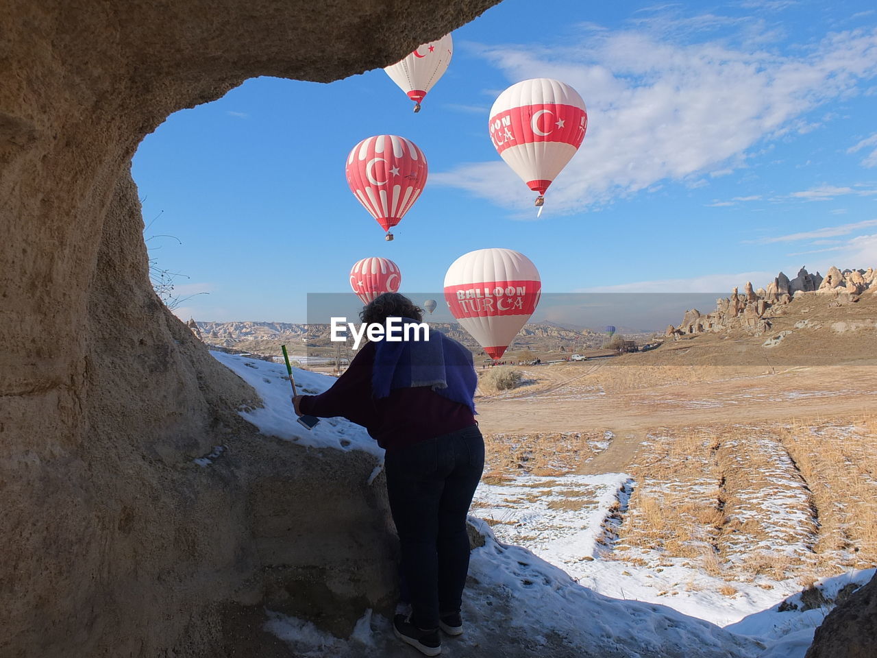 VIEW OF HOT AIR BALLOON AGAINST ROCK