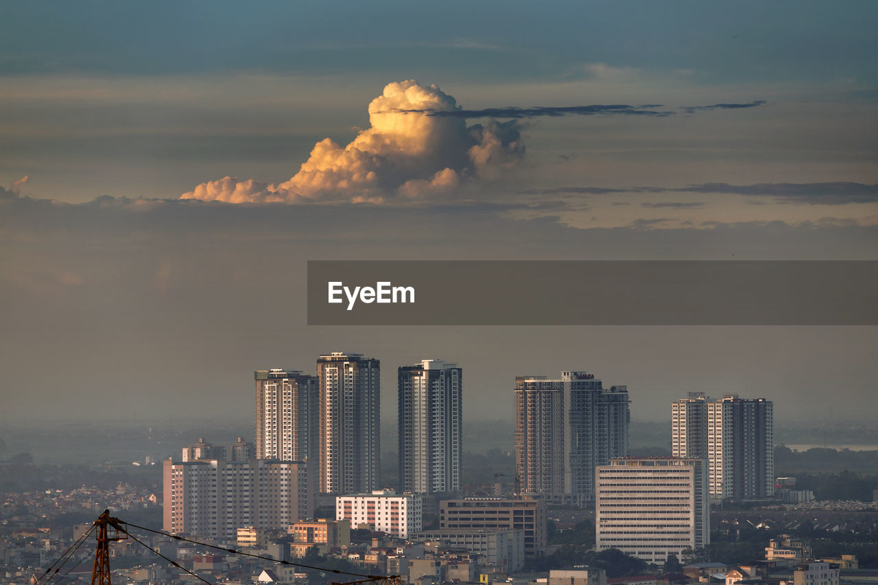 Modern buildings in city against sky