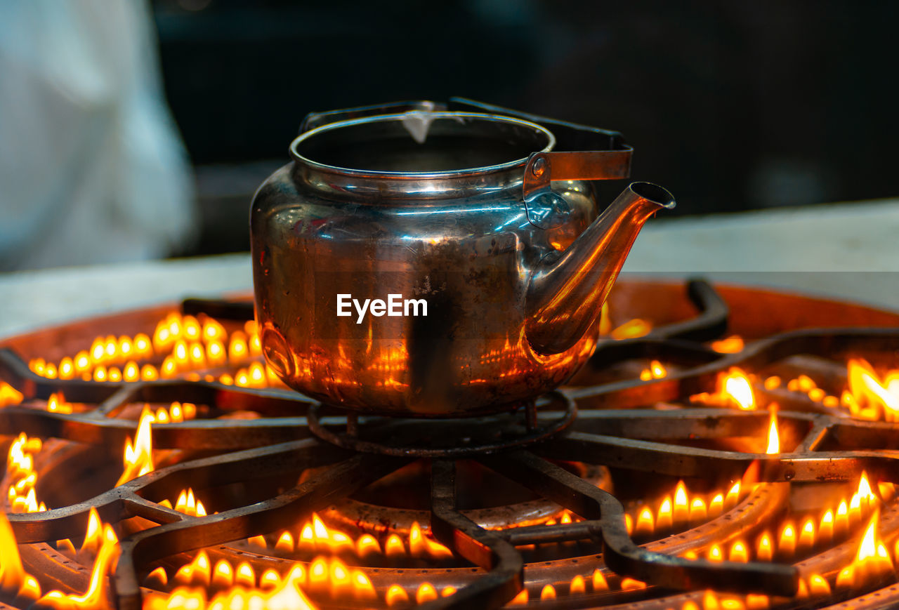 heat, fire, burning, flame, food and drink, food, lighting, focus on foreground, kitchen utensil, household equipment, tea, close-up, nature, hot drink, drink, glowing, no people, freshness, candle, refreshment, illuminated