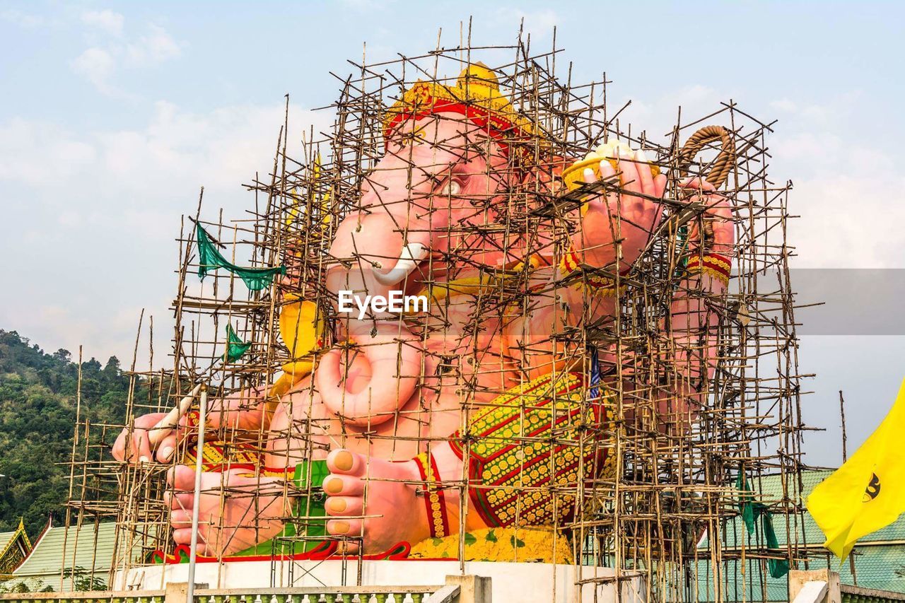 Idol surrounded by bamboo frame