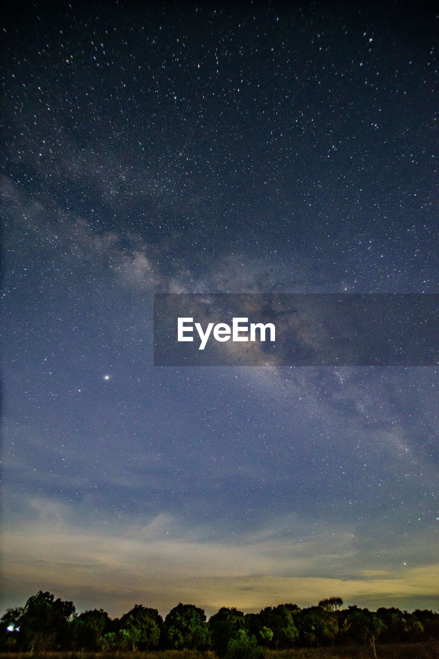 LOW ANGLE VIEW OF STAR FIELD AGAINST SKY