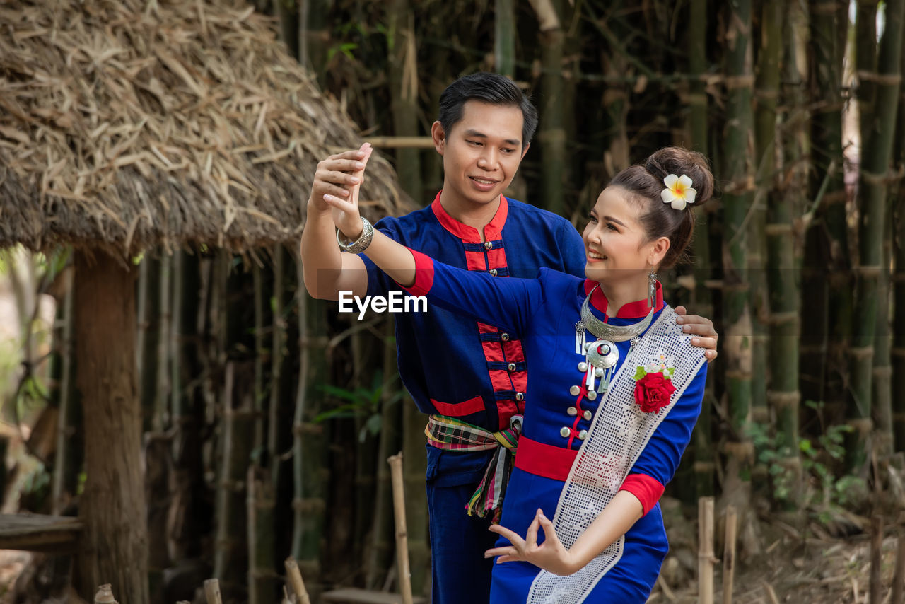 Pre wedding shoot inside garden in thai traditional dress costumes