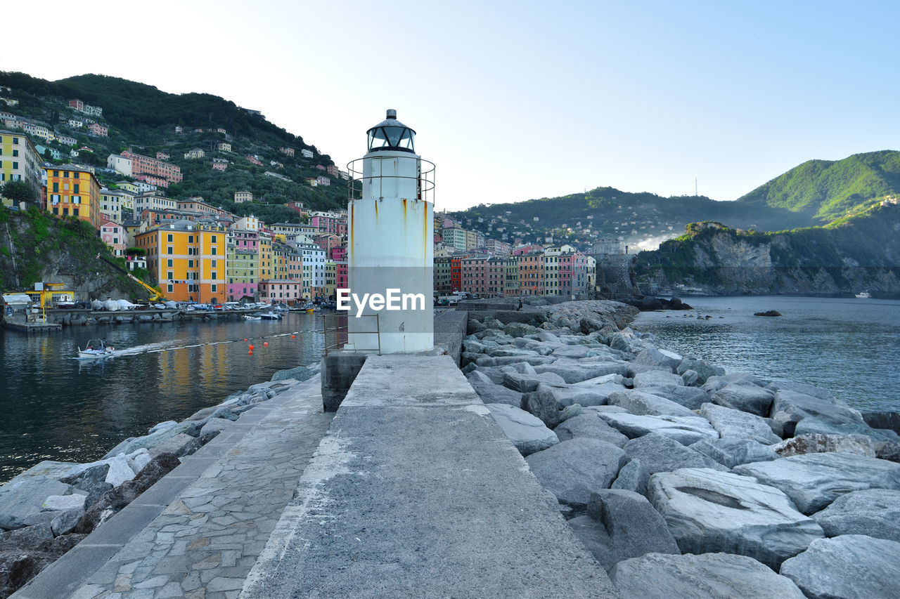 Suggestive view of the seaside town of camogli and the lighthouse on the port