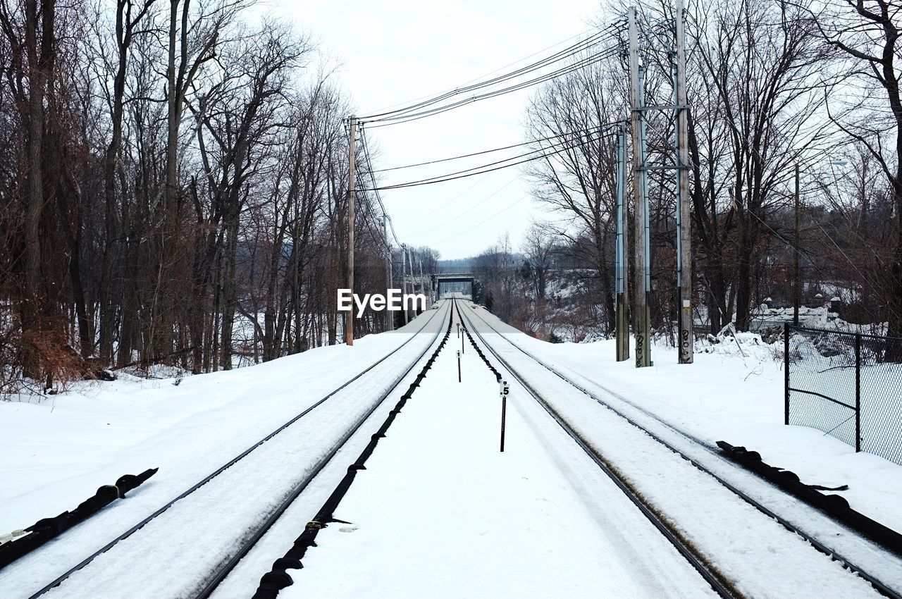 View of snow covered railroad tracks