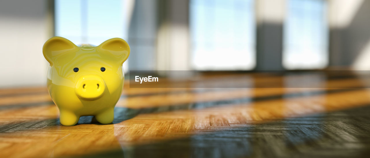 CLOSE-UP OF YELLOW TOYS ON TABLE