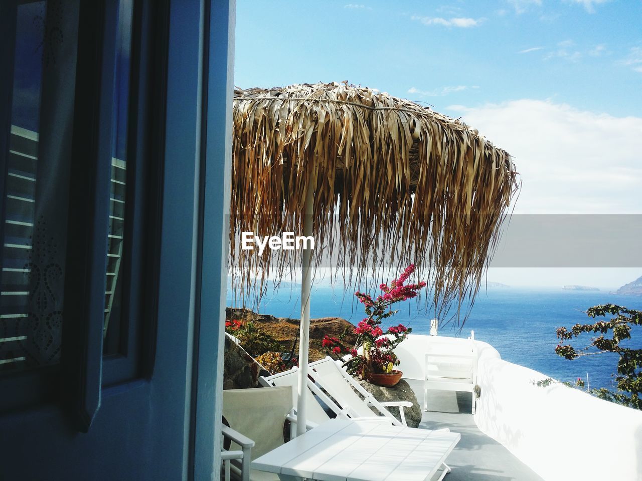 THATCHED ROOF AGAINST SEA