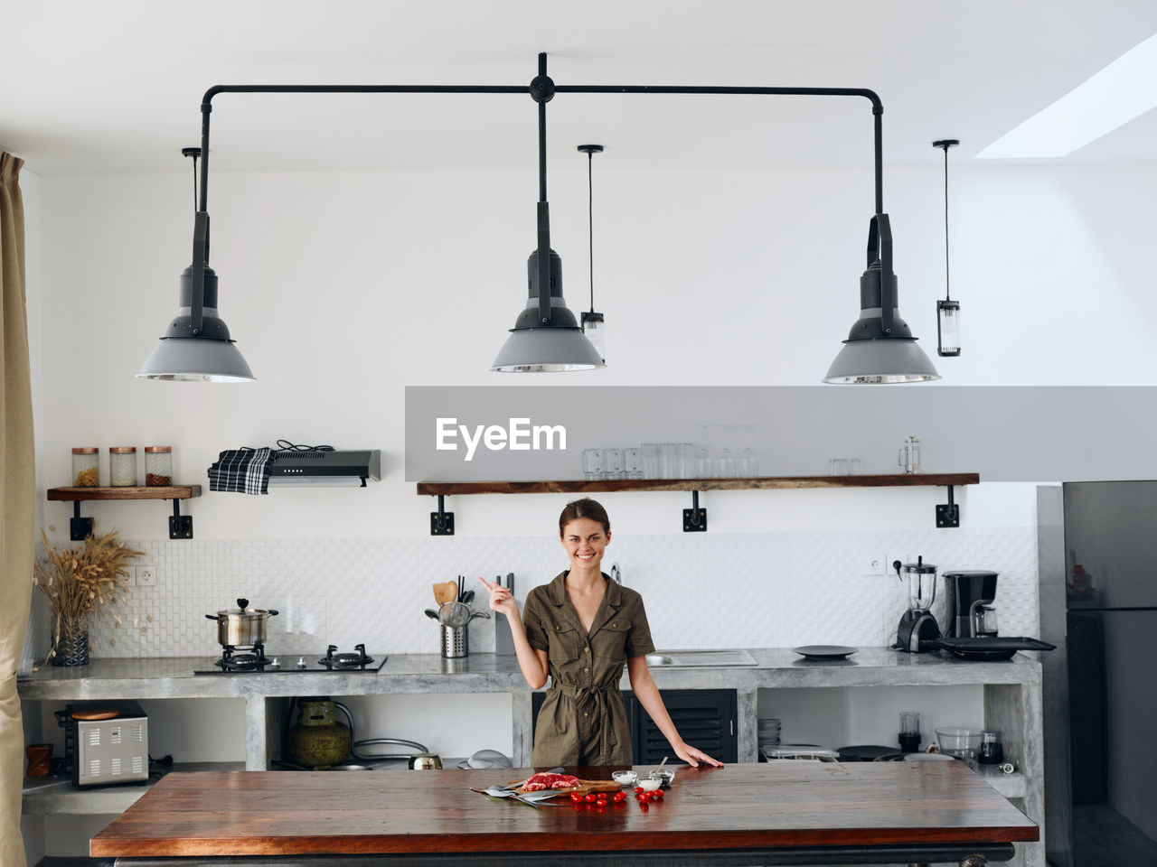 low angle view of young man standing on table at home