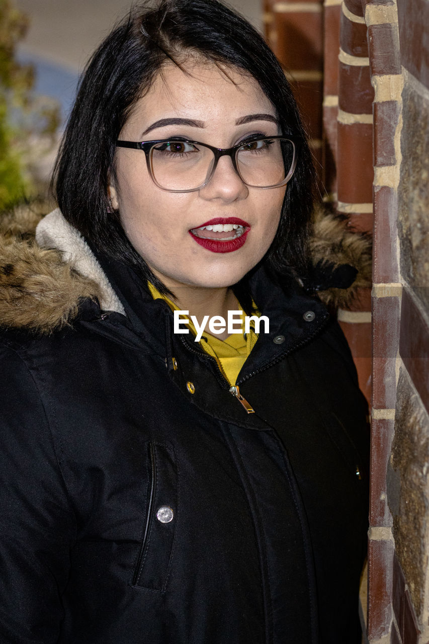 Portrait of smiling woman at home