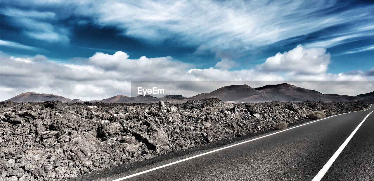 Empty road against sky