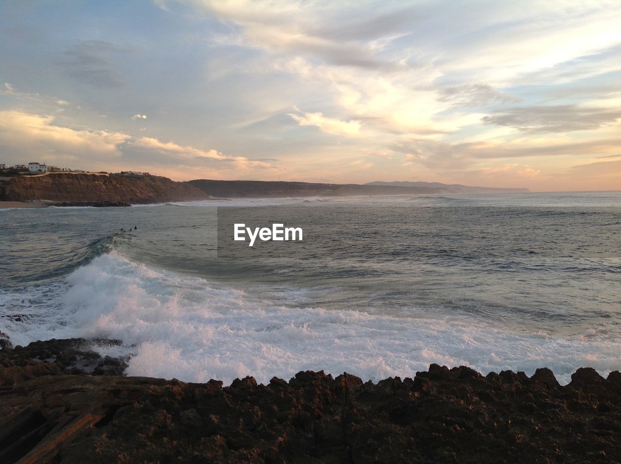 Scenic view of sea against dramatic sky