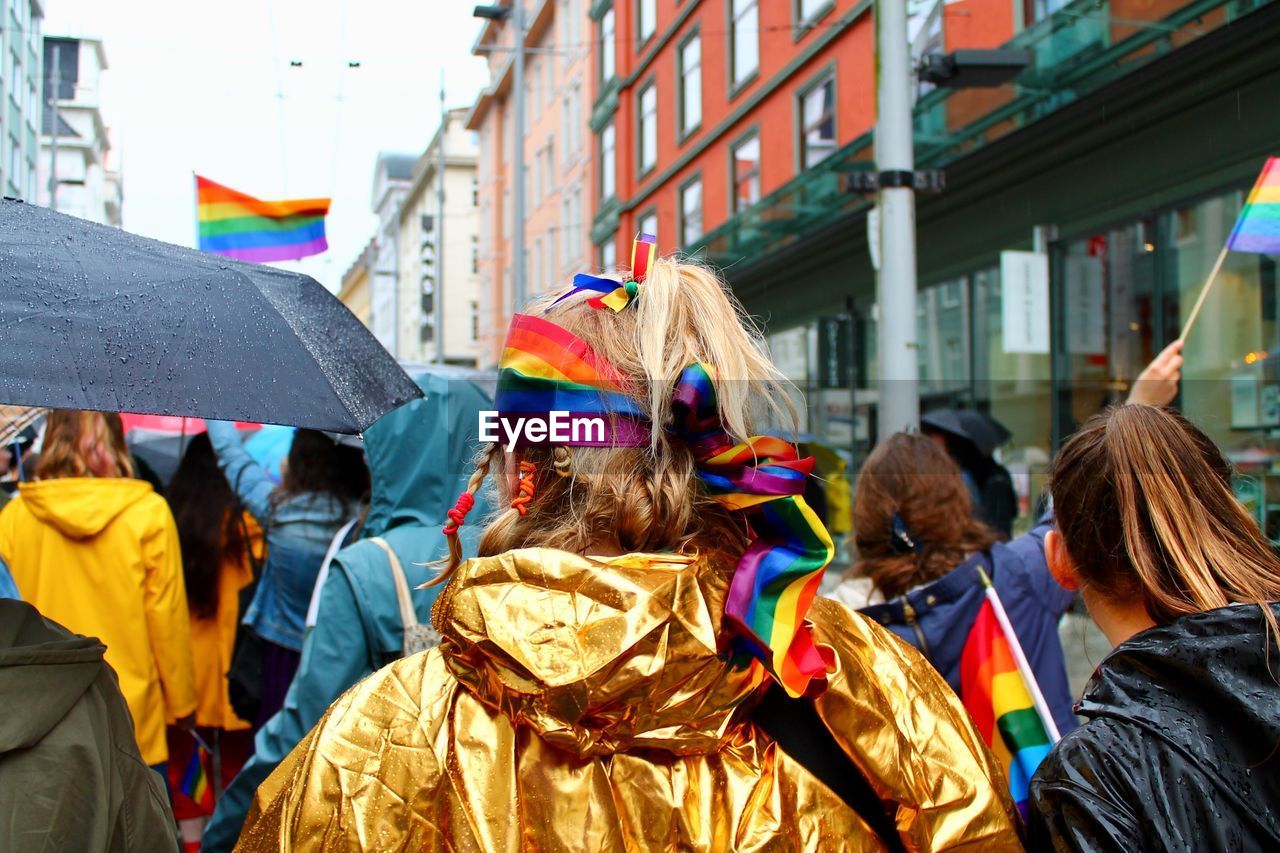 Rear view of people walking in gay pride parade