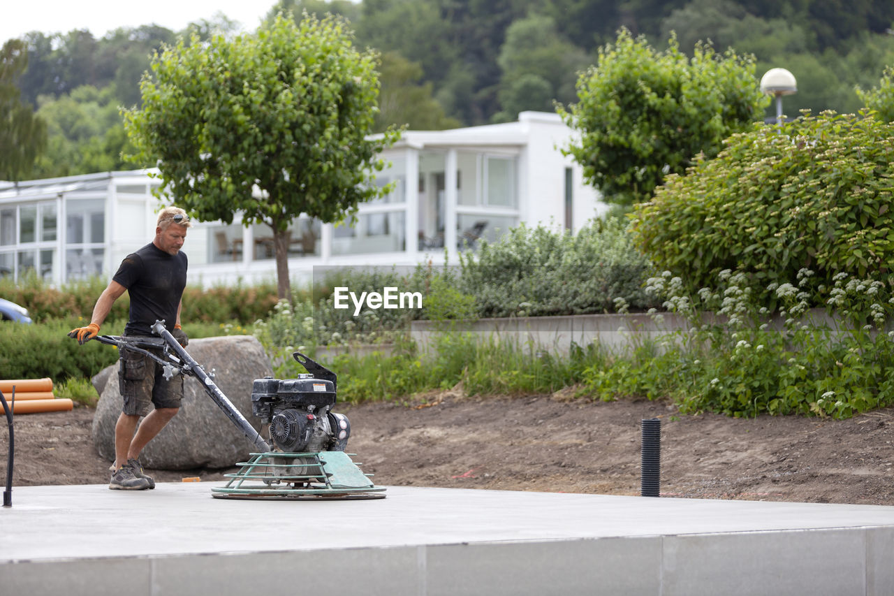 Man preparing concrete foundation