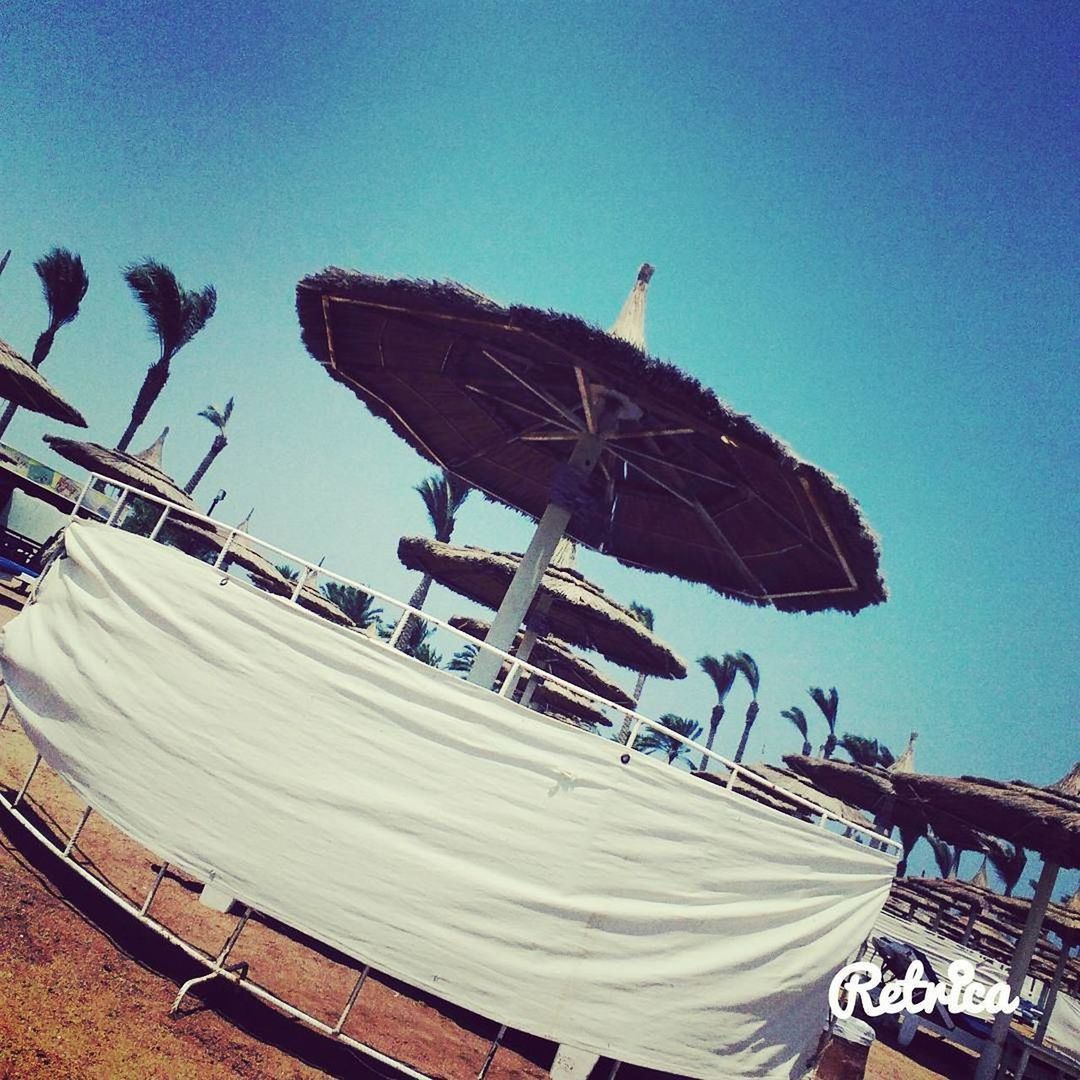 LOW ANGLE VIEW OF BUILT STRUCTURE ON BEACH