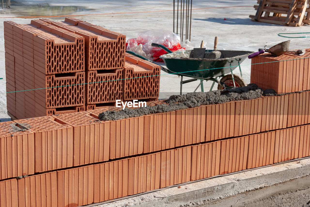 HIGH ANGLE VIEW OF SHOPPING CART AT CONSTRUCTION SITE