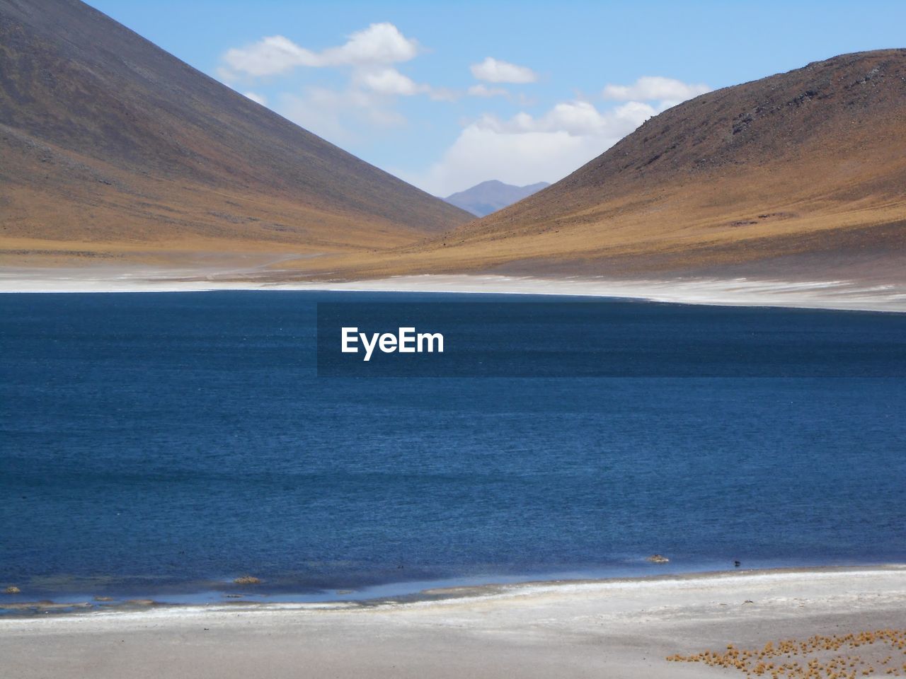 Scenic view of miscanti lake against mountains