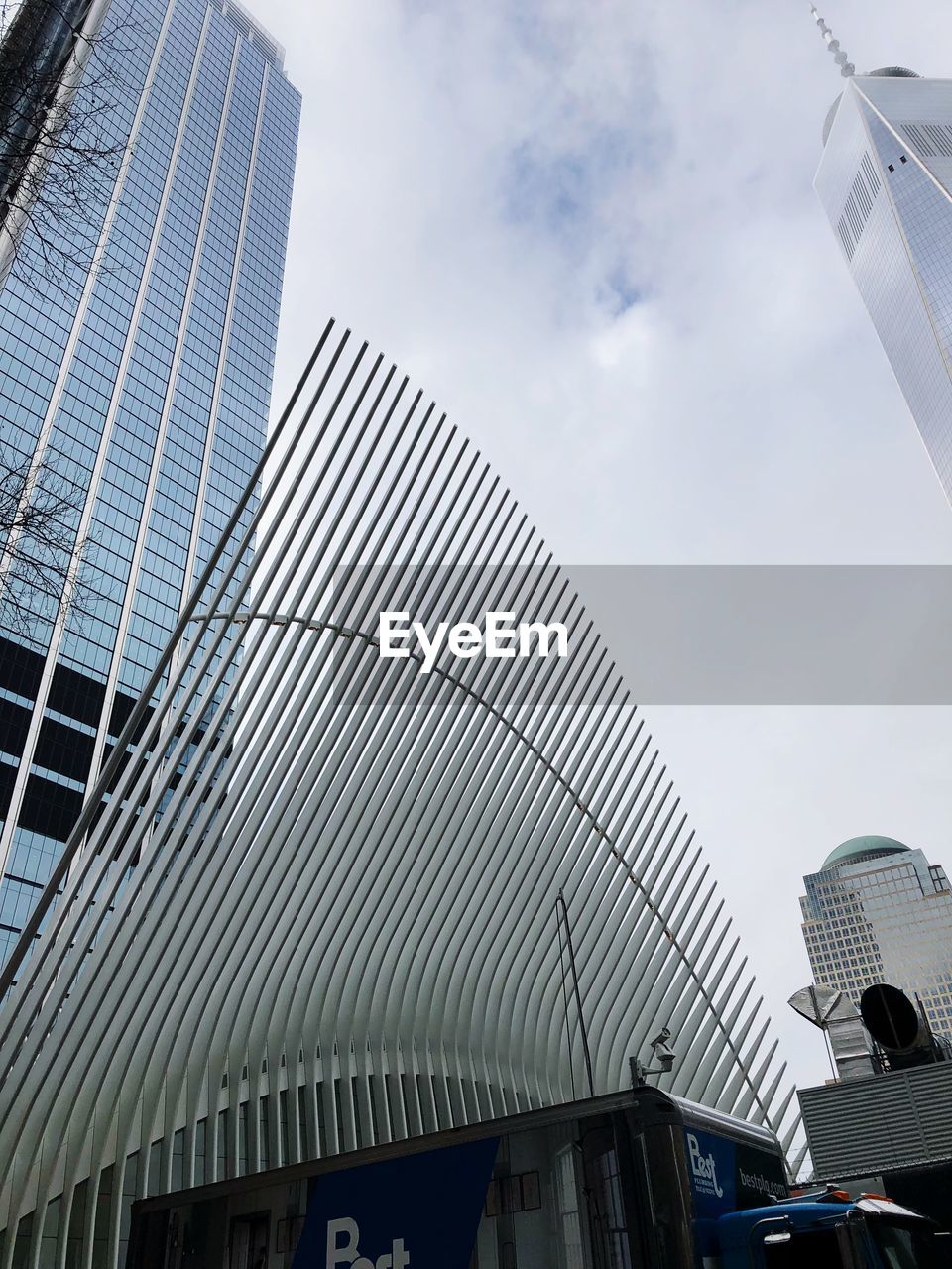 LOW ANGLE VIEW OF OFFICE BUILDING AGAINST SKY