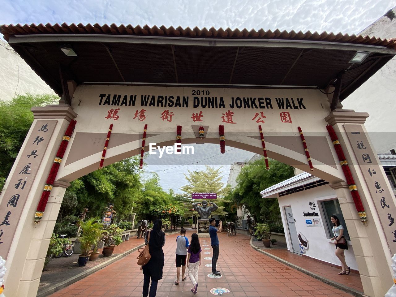 GROUP OF PEOPLE WALKING IN TEMPLE