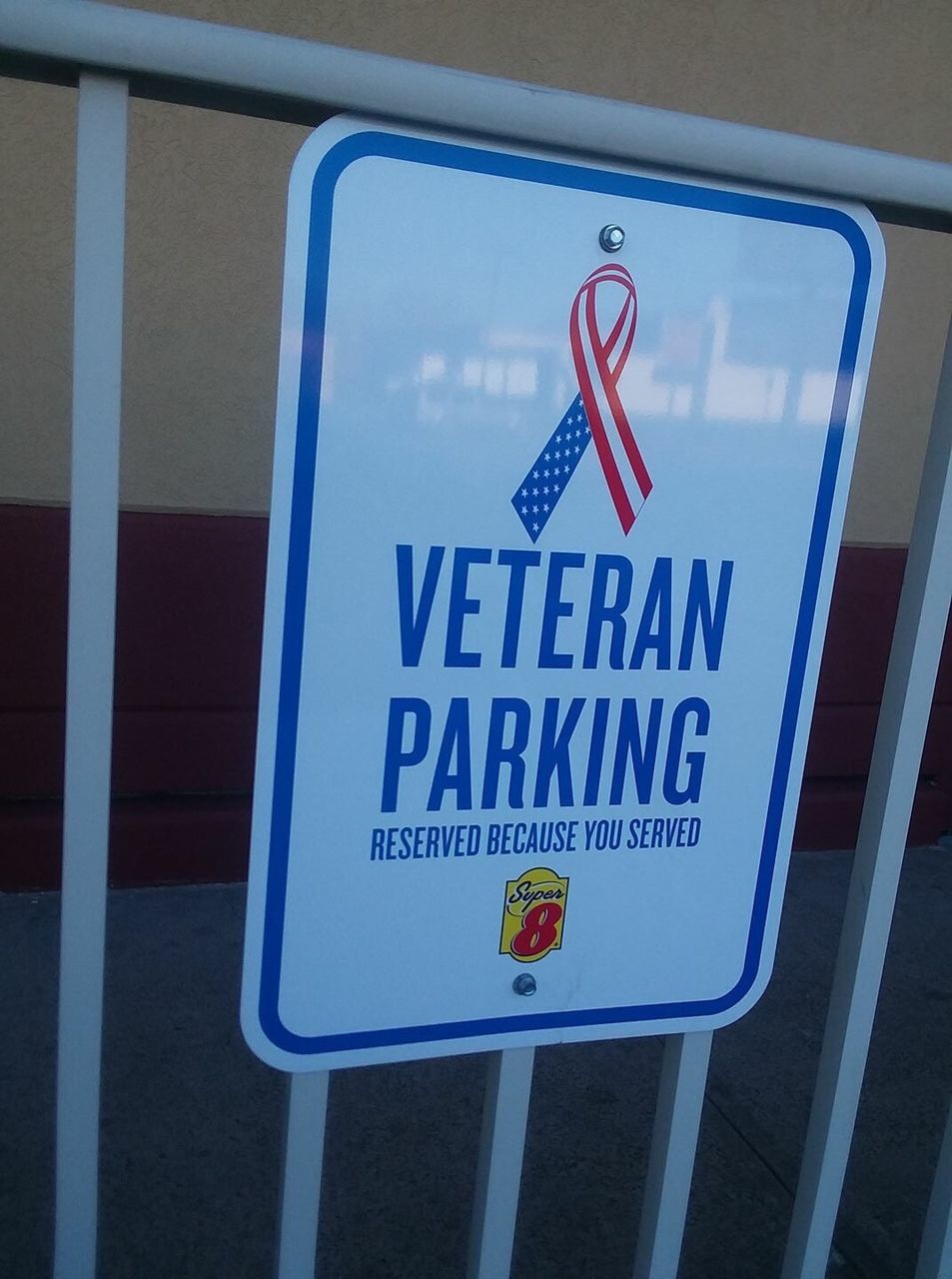 Close-up of information sign on barricade