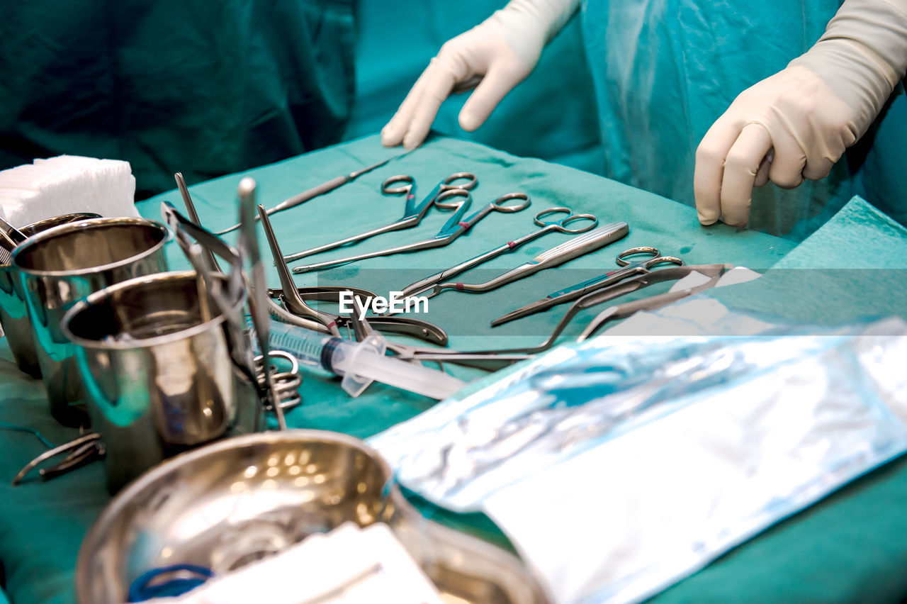 Midsection of doctors standing in hospital