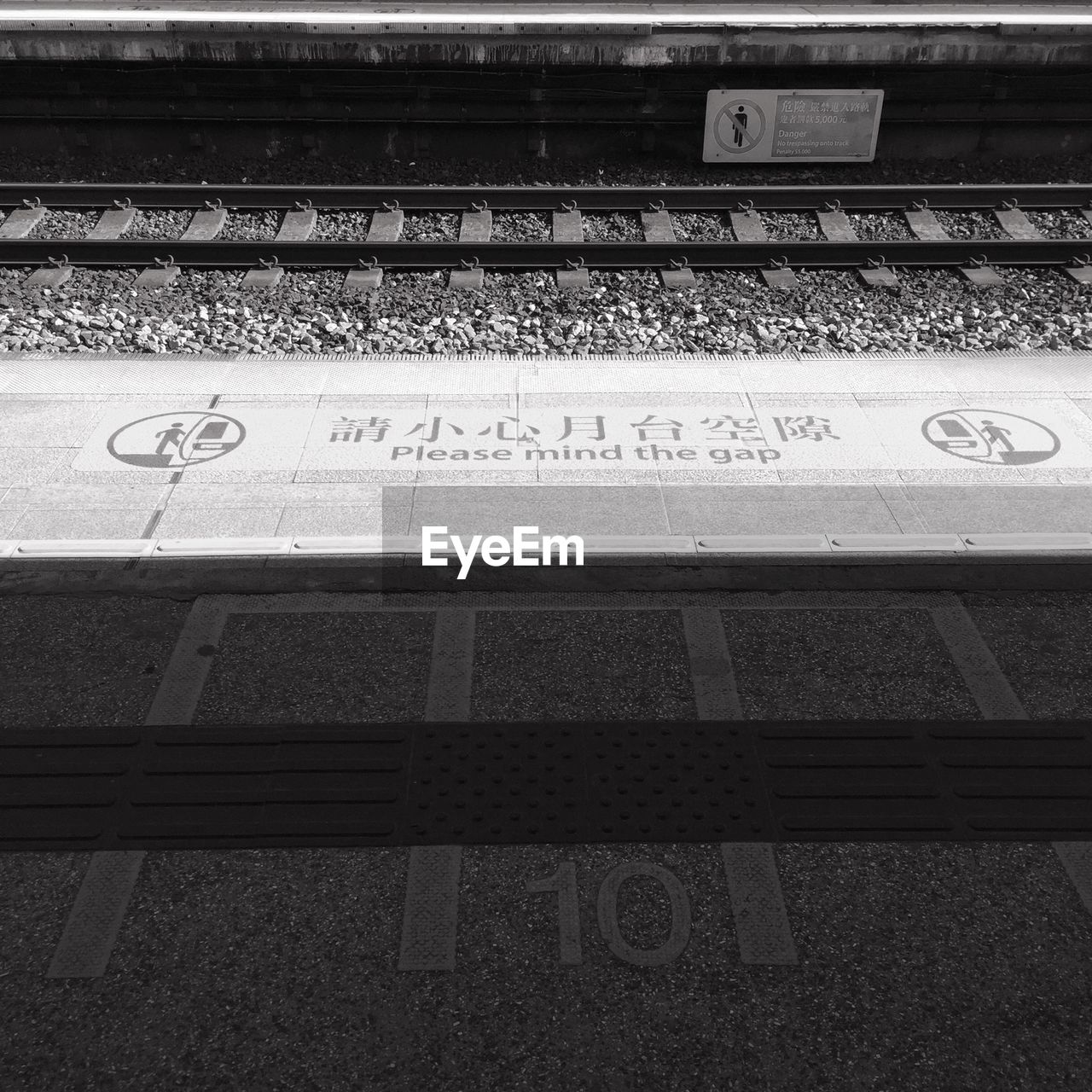 High angle view of text on railroad station platform