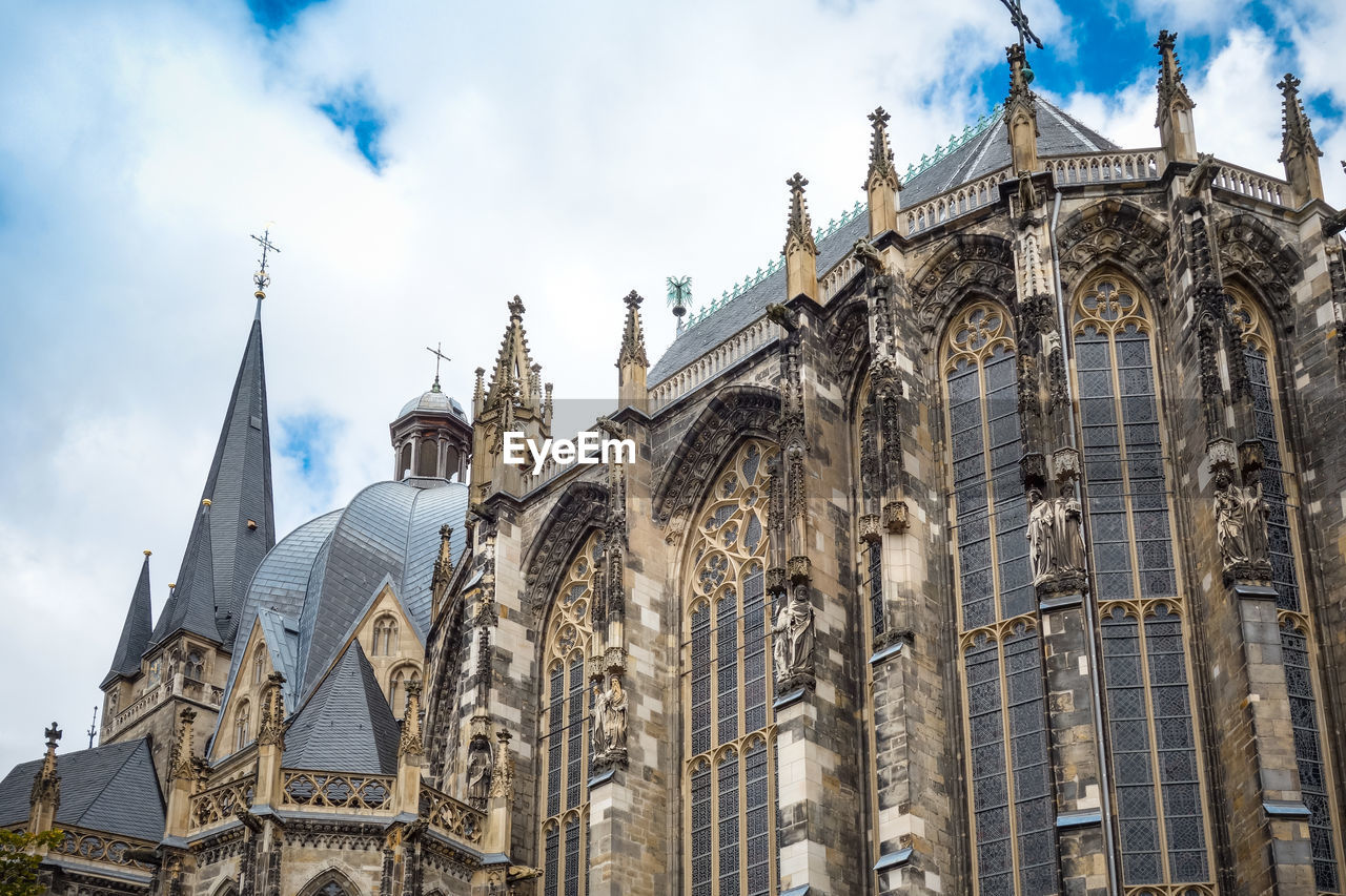 Low angle view of aachen cathedral against sky