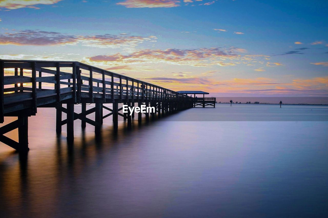 Scenic view of sea against sky at sunset