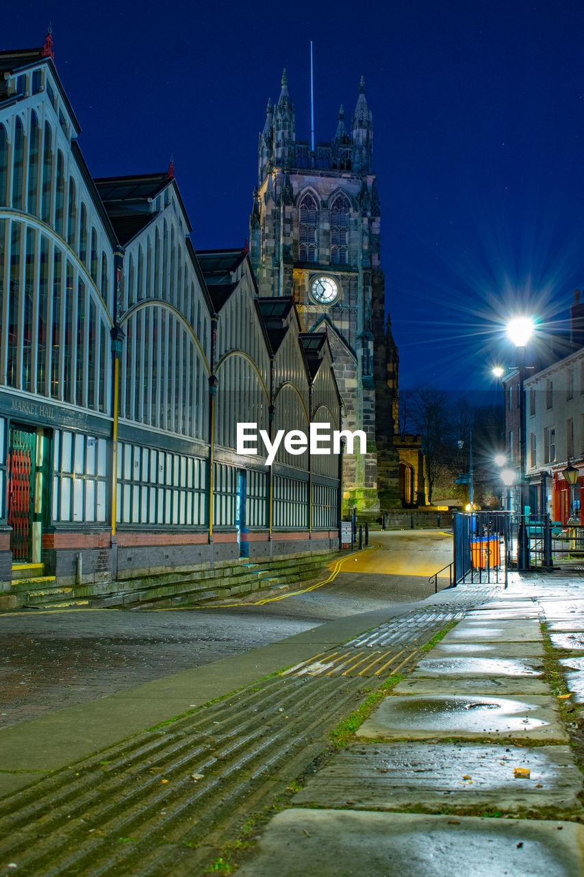 View of buildings in city at night
