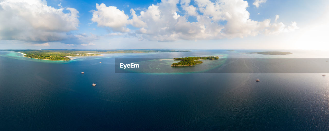 PANORAMIC SHOT OF SEA AGAINST BLUE SKY