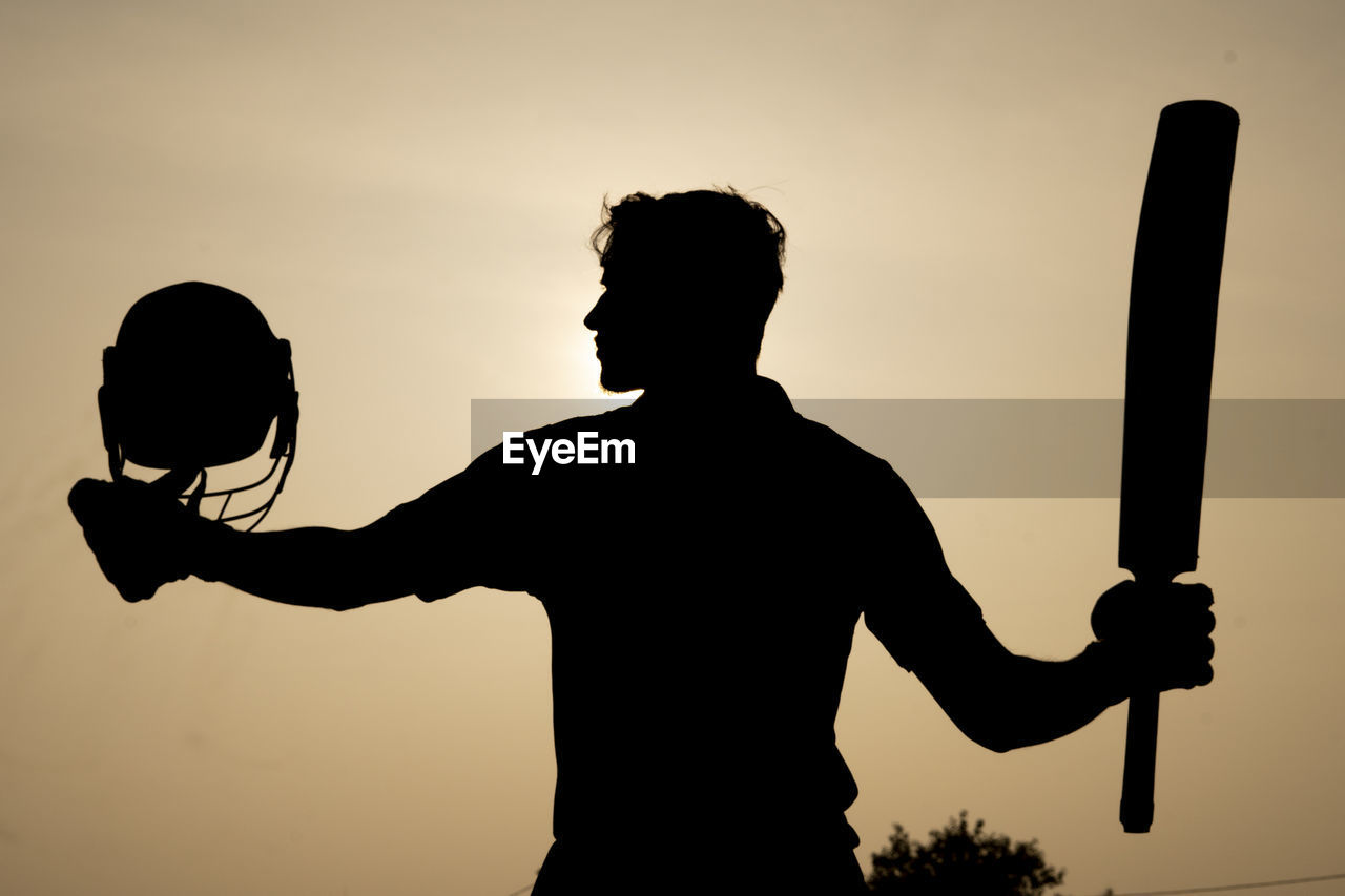 silhouette, men, sky, one person, adult, backlighting, back lit, sunset, waist up, person, nature, standing