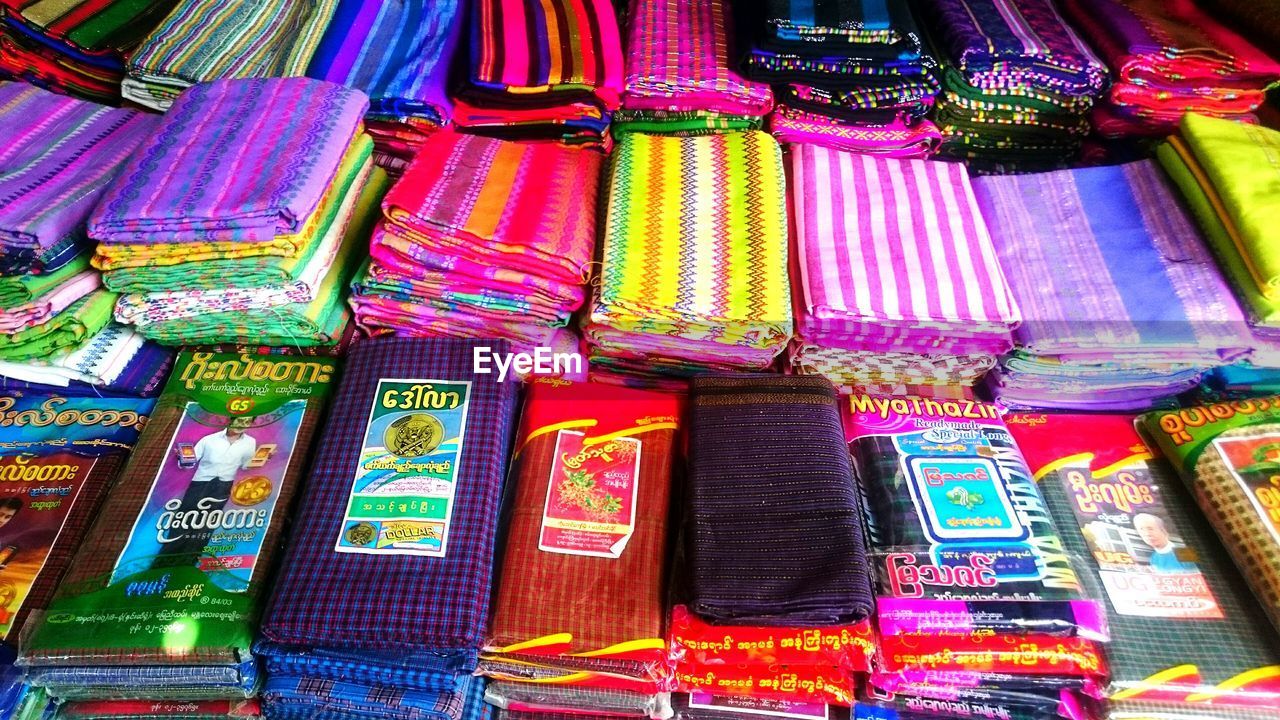 Full frame shot of multi colored fabrics for sale in market