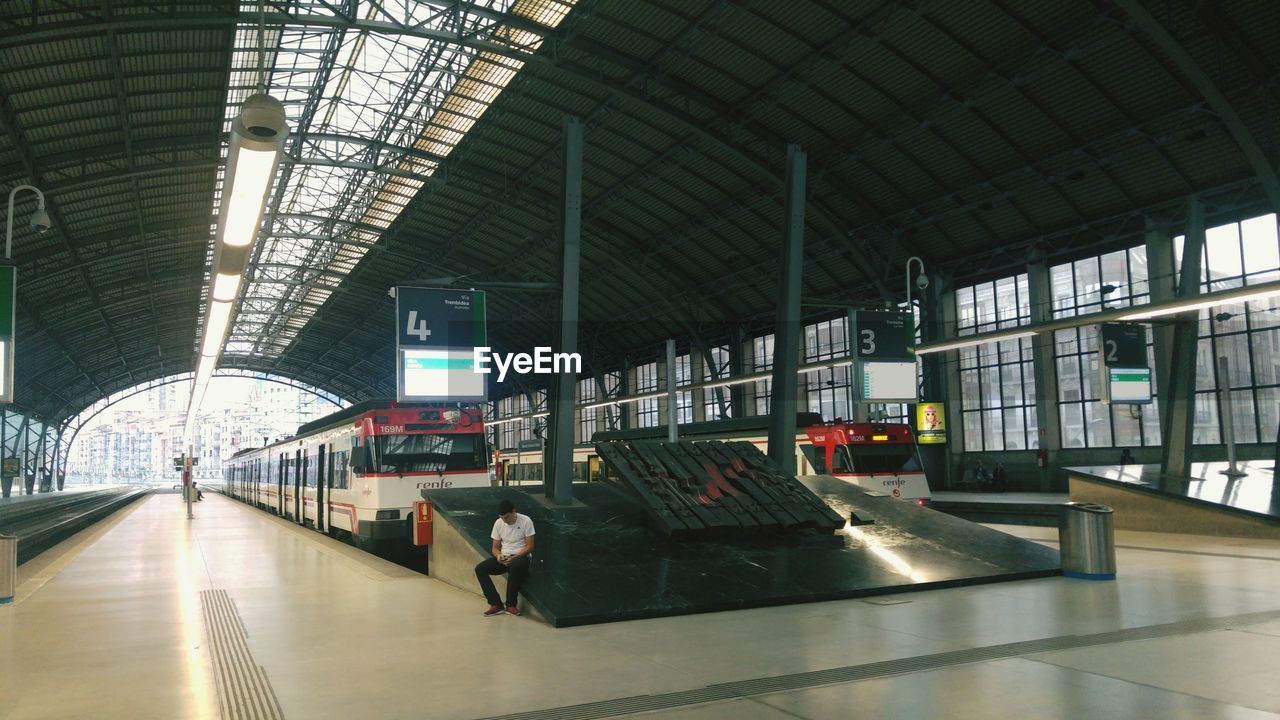 MODERN BUILDING INTERIOR COVERED WITH PEOPLE