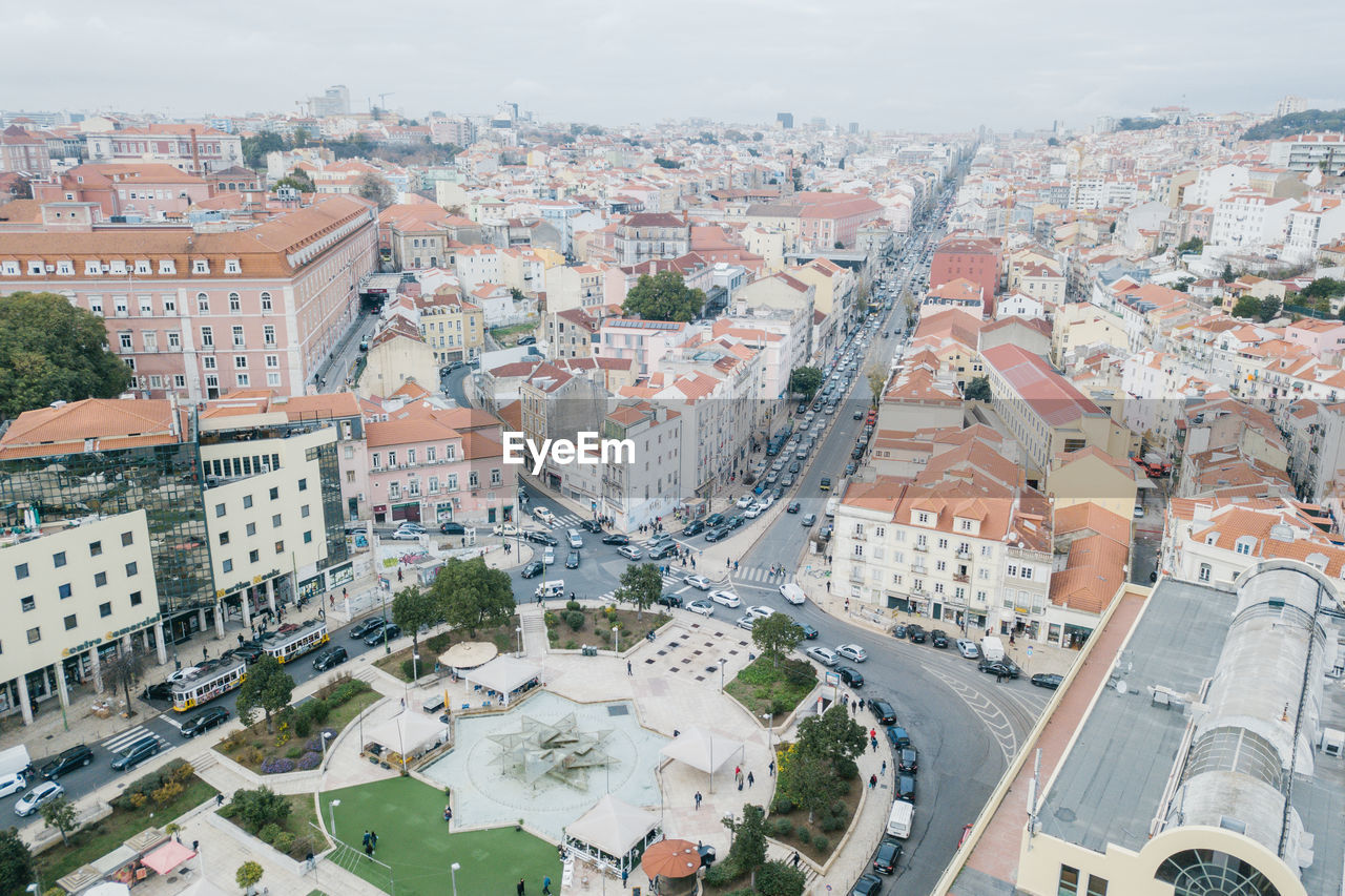 HIGH ANGLE SHOT OF CITYSCAPE AGAINST SKY