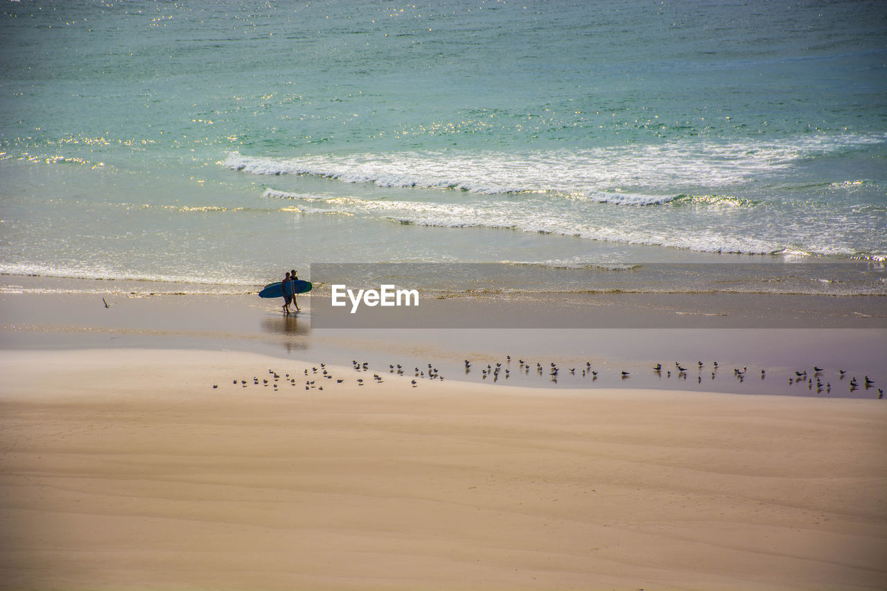 Scenic view of beach by sea