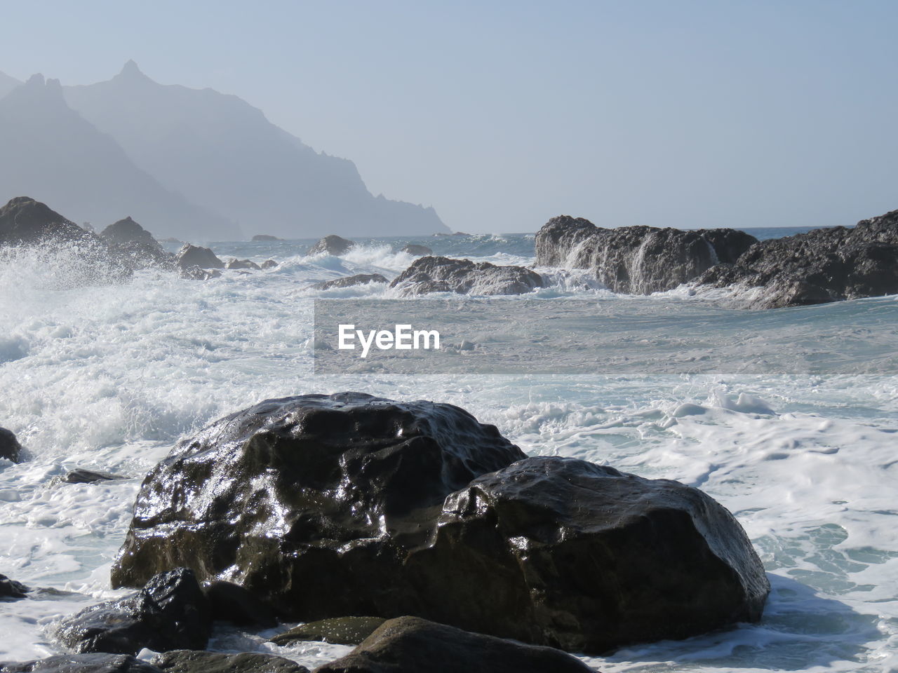 Waves splashing on rocks